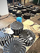 Notched disc blades laid flat showing profile